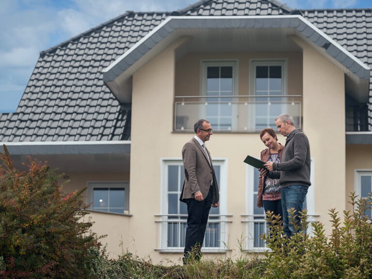 Couple discussing with investor to get insights into the house selling process