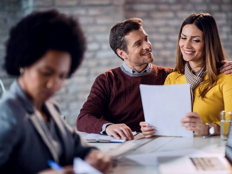 Couple Smiles as They Learn to Sell a House Without a Realtor