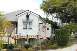 A man making sure the house is in top condition for potential buyer